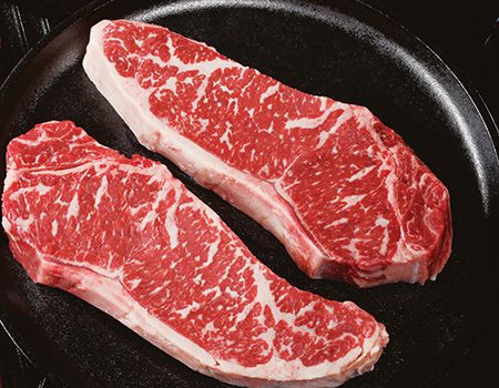 Steaks in skillet.
