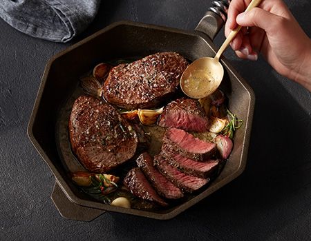 Steaks in skillet.