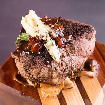Chateaubriand with Sautéed Royal Trumpet and Beech Mushrooms, Bacon Jam, and Blue Cheese recipe