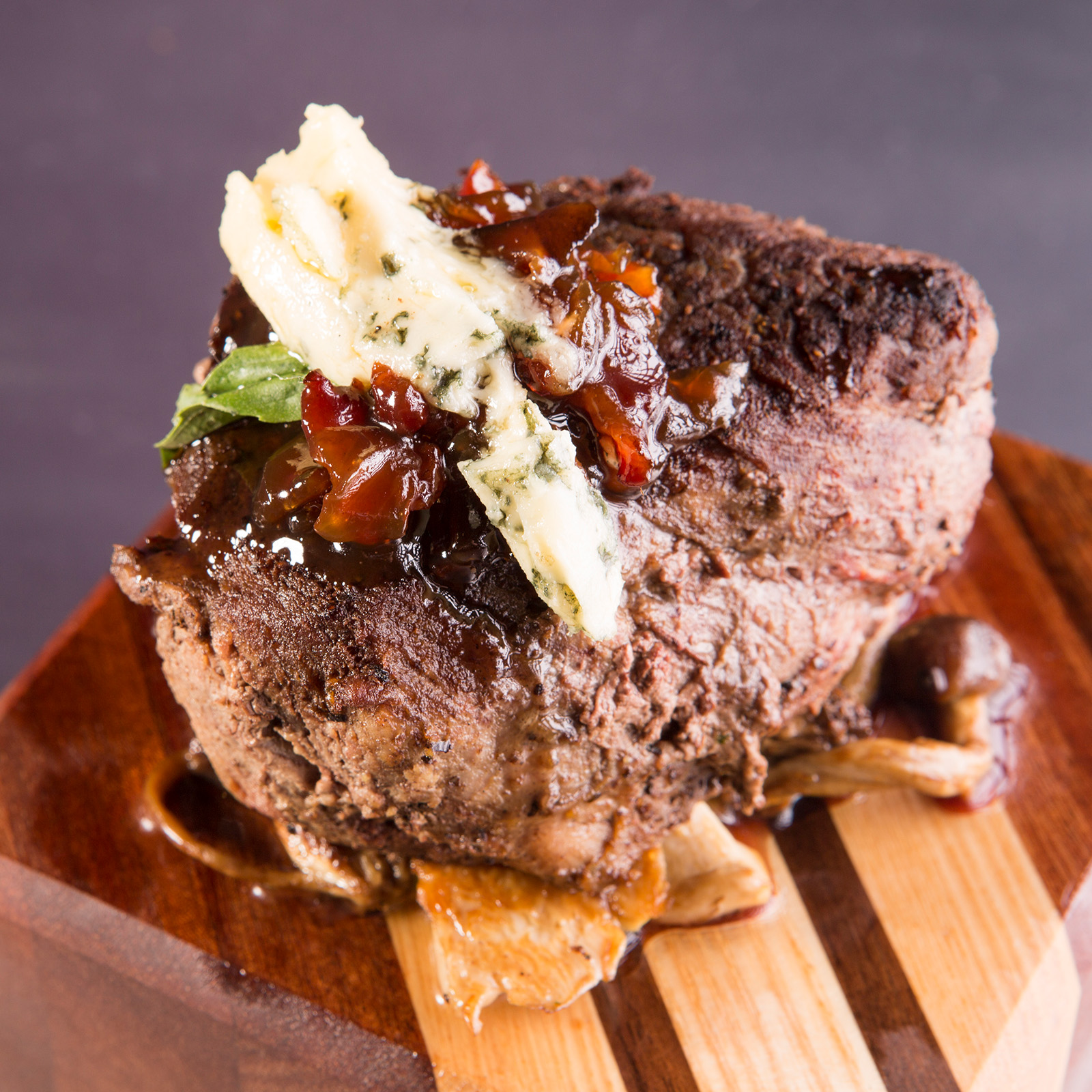 Chateaubriand with Sautéed Royal Trumpet and Beech Mushrooms, Bacon Jam, and Blue Cheese Recipe