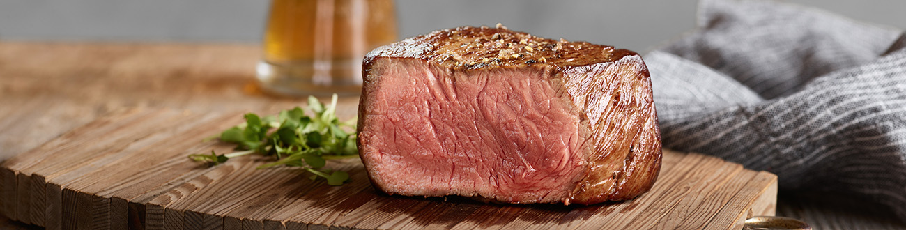 Cooked Signature Cut Strip Steak